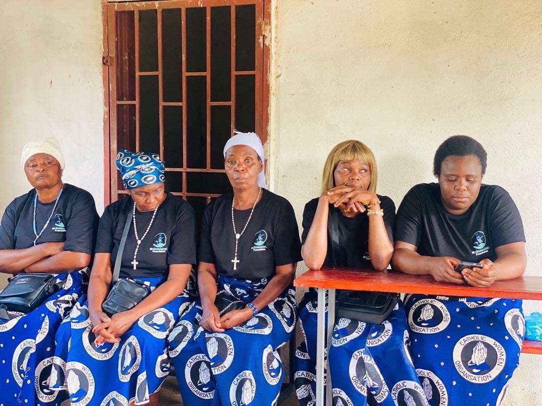 Community outreach participants seated together in MyDreamAdvisor Foundation shirts